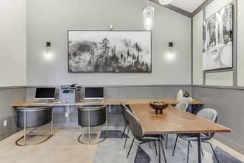 a conference room with a wooden table and chairs and a large picture on the wall at Nobel Court, San Diego, California